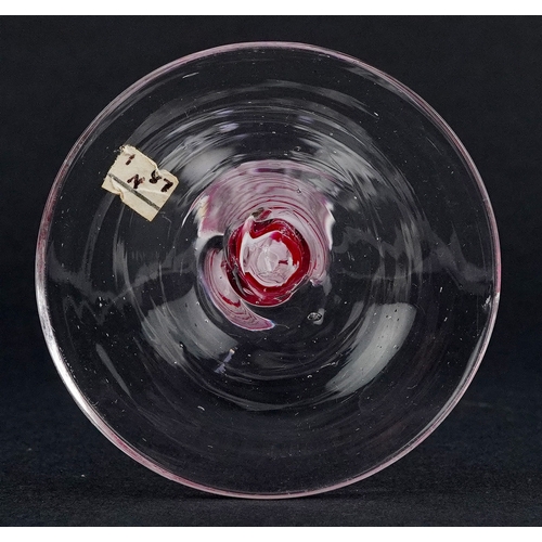 93 - An 18th century wine glass with red and white air twist stem and etched floral decoration, 13cm high... 