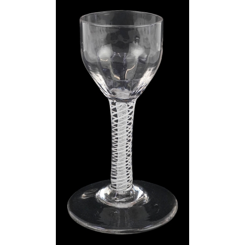 92 - An 18th century wine glass with fluted bowl and air twist stem, 13cm high.