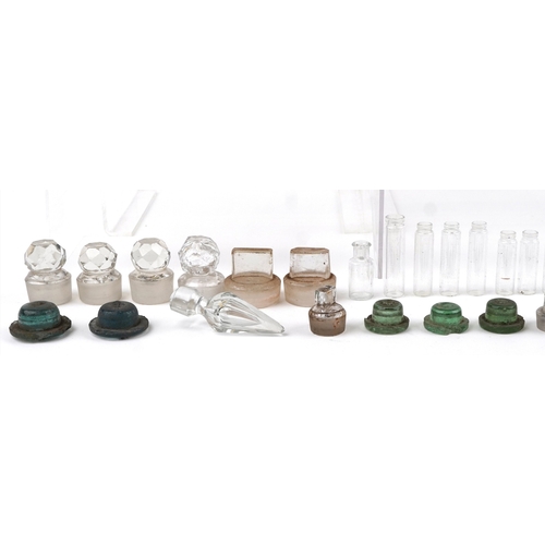 87 - A collection of early 20th century apothecary and pharmaceutical glass bottles together with decante... 