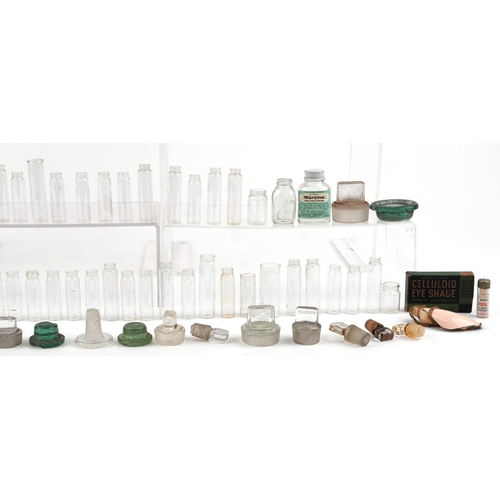 87 - A collection of early 20th century apothecary and pharmaceutical glass bottles together with decante... 