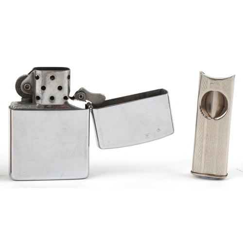 101 - Smoking items comprising a Zippo Harley Davidson lighter, a brass musical lighter and a white metal ... 