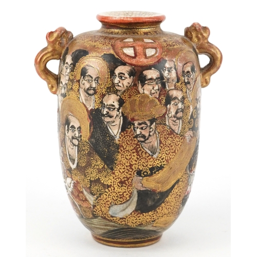 55 - A Japanese Satsuma earthenware miniature vase finely hand painted with figures, having twin dragon h... 