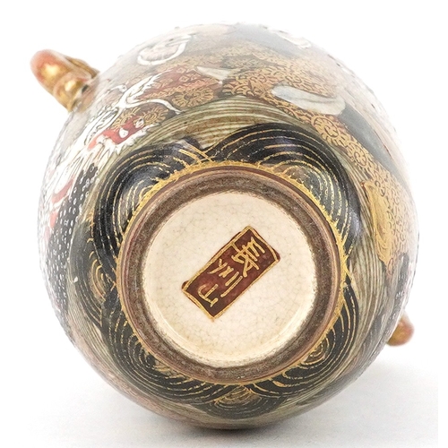 55 - A Japanese Satsuma earthenware miniature vase finely hand painted with figures, having twin dragon h... 