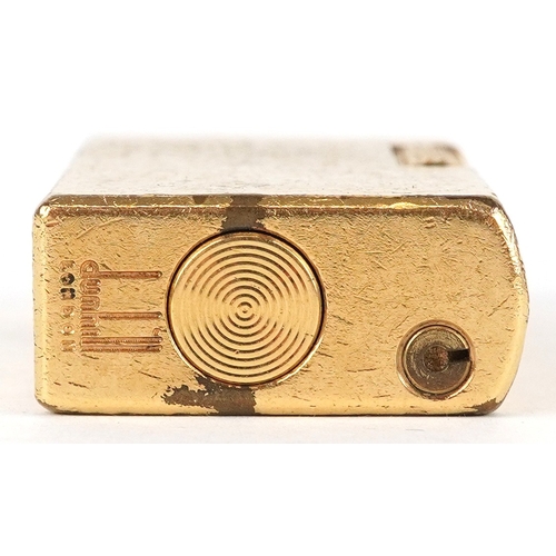 99 - Dunhill, a gold plated pocket lighter with box, 6cm high.