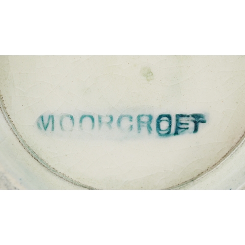 72 - Moorcroft, a hand painted Iris pattern pottery squat vase, impressed marks to the base, 7cm high.