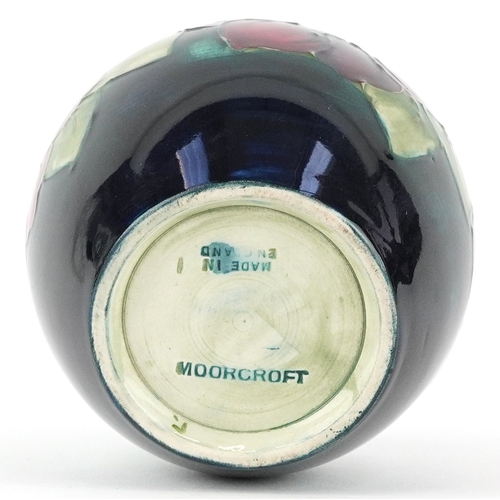 71 - Moorcroft, a hand painted Clematis pattern pottery vase, impressed marks to the base, 13cm high.