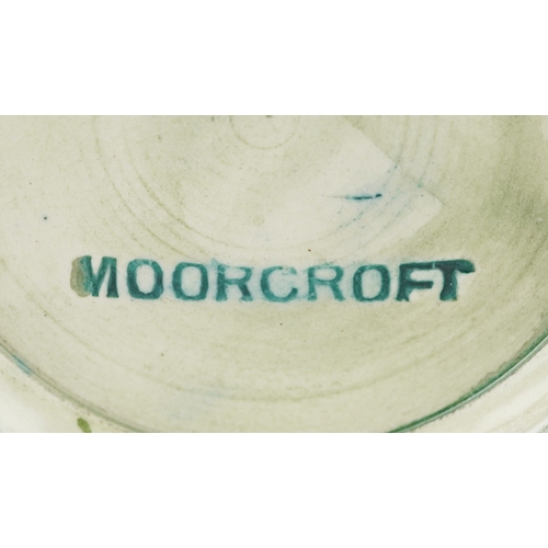 71 - Moorcroft, a hand painted Clematis pattern pottery vase, impressed marks to the base, 13cm high.