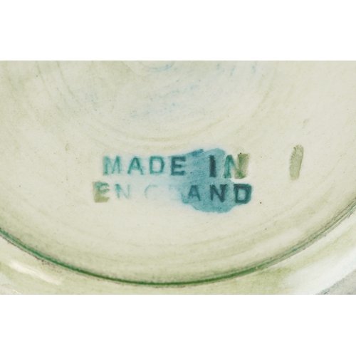 71 - Moorcroft, a hand painted Clematis pattern pottery vase, impressed marks to the base, 13cm high.