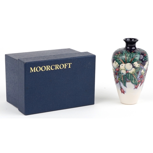 69 - Nicola Slaney for Moorcroft, a Snowberry pattern pottery vase inscribed 2002 to the base, 15.5cm hig... 