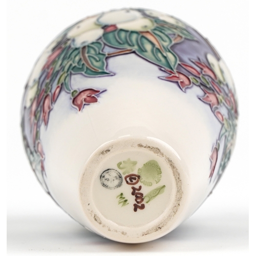 69 - Nicola Slaney for Moorcroft, a Snowberry pattern pottery vase inscribed 2002 to the base, 15.5cm hig... 