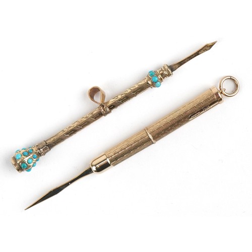 105 - An antique unmarked gold cased propelling toothpick set with turquoise cabochons and amethyst togeth... 