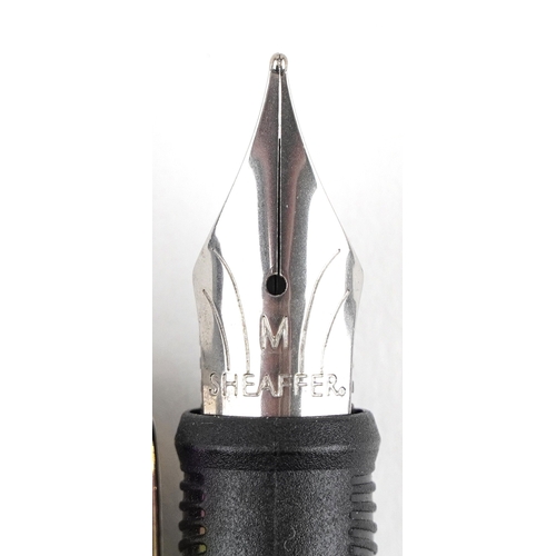 114 - Sheaffer, a Sheaffer Plasma rainbow fountain pen with box and paperwork.