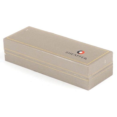 114 - Sheaffer, a Sheaffer Plasma rainbow fountain pen with box and paperwork.