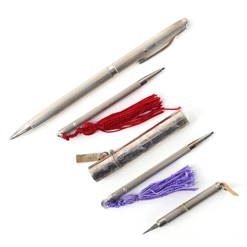 115 - Silver objects comprising an engine turned ballpoint pen, two silver cased propelling pencils, a sil... 