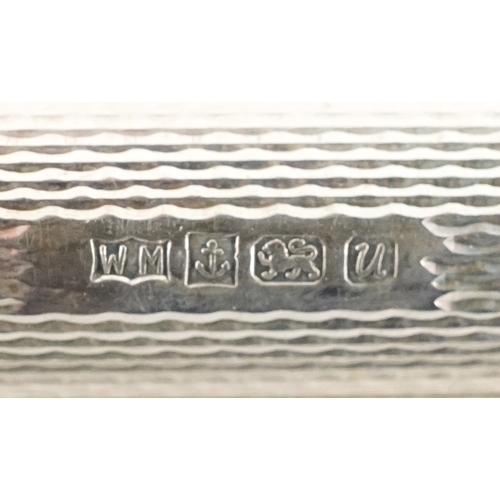 115 - Silver objects comprising an engine turned ballpoint pen, two silver cased propelling pencils, a sil... 