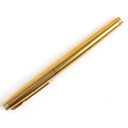 116 - A gold plated engine turned Parker fountain pen having a 14ct gold nib, 12.5cm in length, with box.