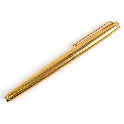 116 - A gold plated engine turned Parker fountain pen having a 14ct gold nib, 12.5cm in length, with box.