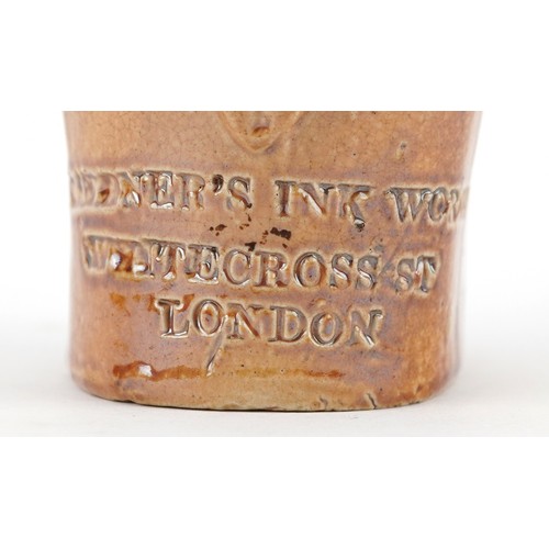 30 - A Victorian salt glazed stoneware inkwell modelled as a seated Mr. Punch, impressed For Gardner's In... 