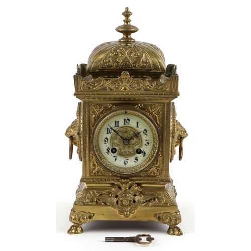  Antique French brass mantle clock cast with lion heads and Putto, striking on a gong, the enamelled ... 