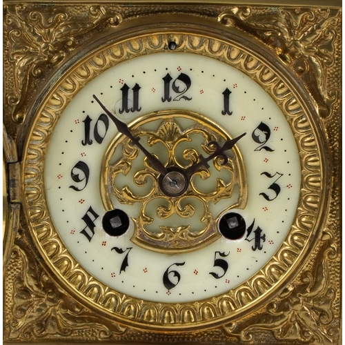  Antique French brass mantle clock cast with lion heads and Putto, striking on a gong, the enamelled ... 