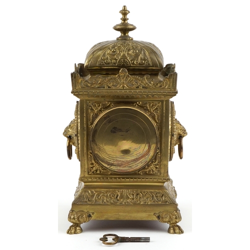  Antique French brass mantle clock cast with lion heads and Putto, striking on a gong, the enamelled ... 