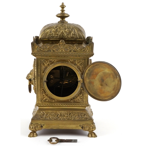  Antique French brass mantle clock cast with lion heads and Putto, striking on a gong, the enamelled ... 