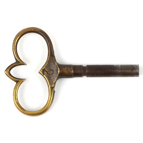  Antique French brass mantle clock cast with lion heads and Putto, striking on a gong, the enamelled ... 