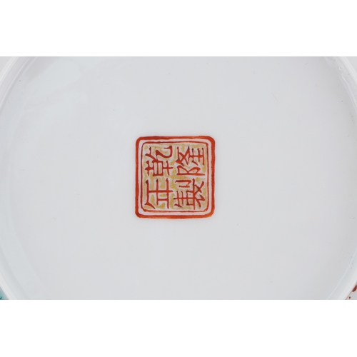  Chinese porcelain footed bowl hand painted in the famille rose palette with an emperor and attendant... 