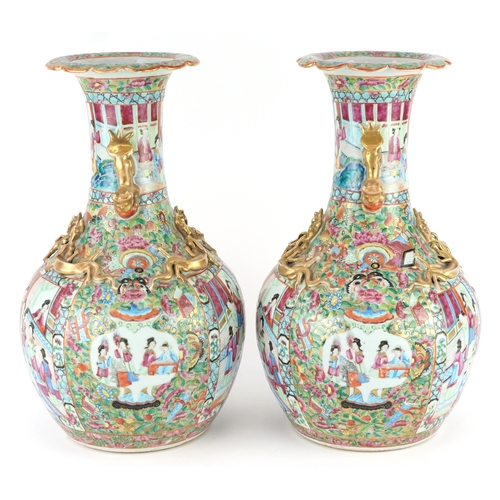  Pair of Chinese Canton porcelain vases hand painted in the famille rose palette with an emperor and ... 