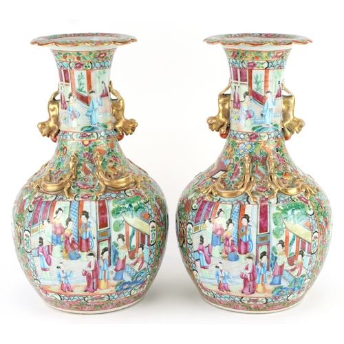  Pair of Chinese Canton porcelain vases hand painted in the famille rose palette with an emperor and ... 