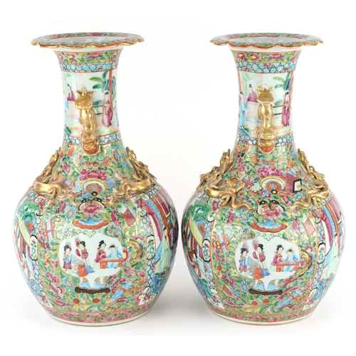  Pair of Chinese Canton porcelain vases hand painted in the famille rose palette with an emperor and ... 
