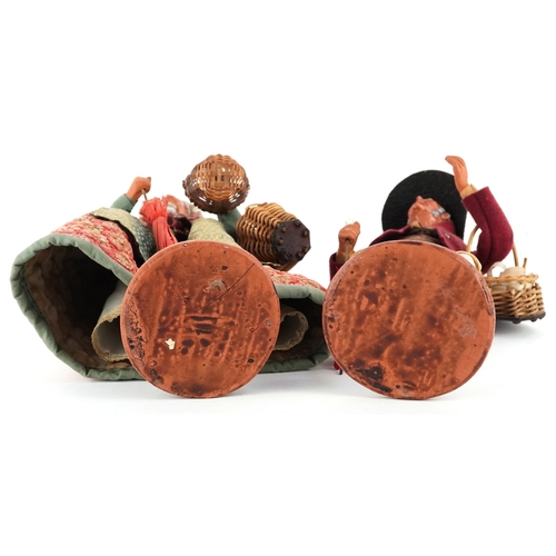  Two French terracotta dolls/figures, signed S Jouglas, the largest 29cm high.