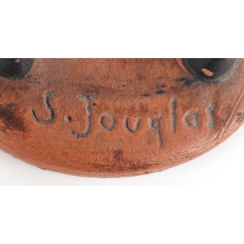  Two French terracotta dolls/figures, signed S Jouglas, the largest 29cm high.