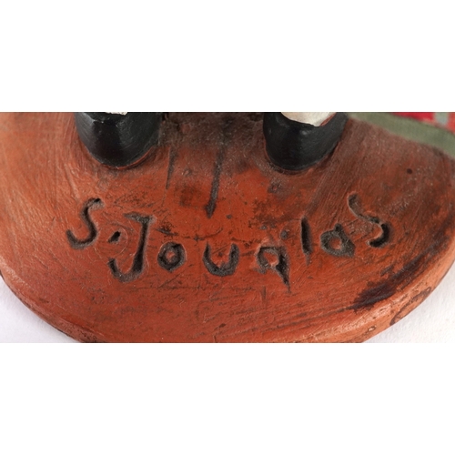 Two French terracotta dolls/figures, signed S Jouglas, the largest 29cm high.