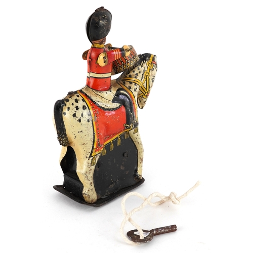  Wells Brimtoy tinplate clockwork drummer on horse, 14cm high.