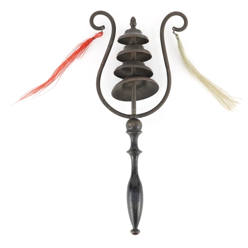 Antique lyre shaped sistrum/rattle with four bells and carved wood handle, 23cm high.