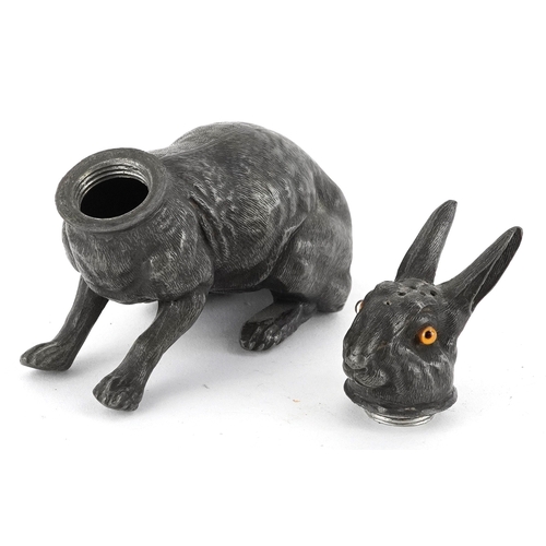  Antique pewter pounce pot in the form of a hare with glass eyes, 12cm wide.