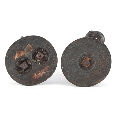 44 - Two 19th century E G Zimmerman cast iron figural match holders, the largest 9cm high.