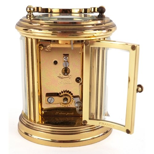  20th century French gilt brass carriage clock, the white enamel dial having black Roman numerals, de... 