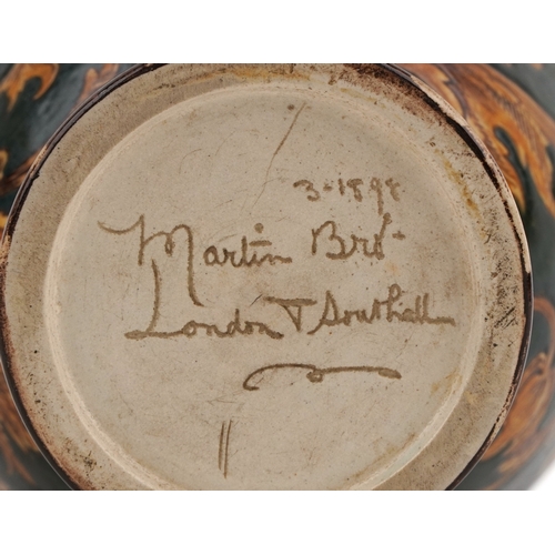  Martin Brothers stoneware vase decorated with scrolling foliage, Lizards and insects, incised Martin... 