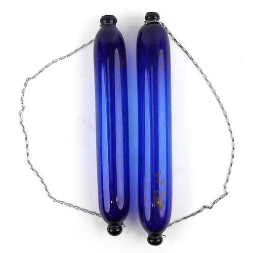  Two Victorian cobalt blue glass rolling pins, the largest 41cm wide.