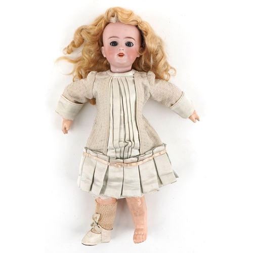 Bebe Jumeau, 19th century French bisque headed doll with silk dress, 35cm high.
