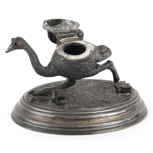 51 - 19th century novelty pewter inkwell in the form of an ostrich raised on a plinth base, 19cm wide.