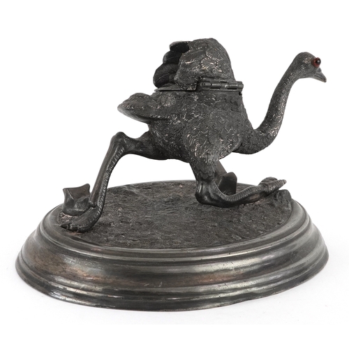51 - 19th century novelty pewter inkwell in the form of an ostrich raised on a plinth base, 19cm wide.