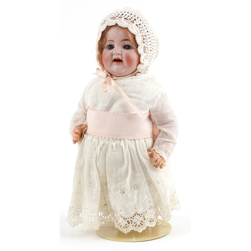 Simon & Halbig for Kammer Reinhardt 19th century German bisque headed doll with lace dress and crocheted bonnet, 33cm high.