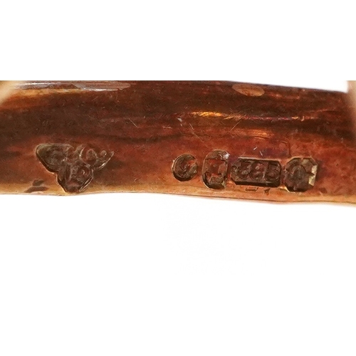  14ct two tone gold flower head brooch set with nine diamond solitaires, 5cm wide, 16.0g.