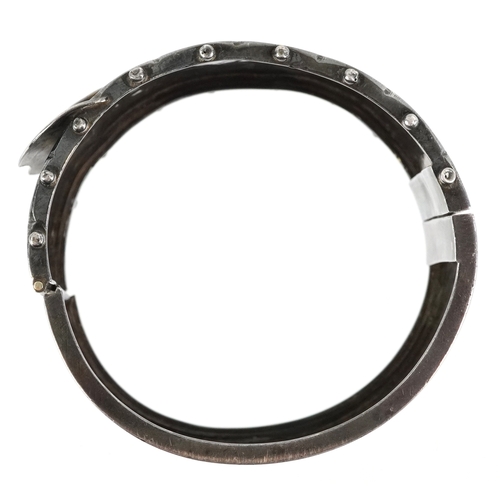  Victorian silver belt buckle design bangle with engraved floral decoration, Birmingham 1884, 6cm wid... 