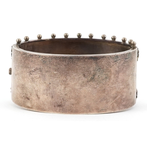  Victorian silver bangle, Birmingham 1885, 7cm wide, 39.1g.