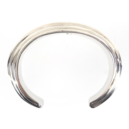  Bayanihan, Modernist sterling silver bangle, 7.5cm wide, 48.5g.