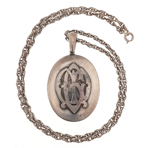 Victorian silver mourning locket with monogram, on a silver necklace ...